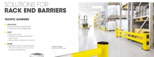 Yellow rack end barriers installed in front of industrial shelving in a warehouse, protecting the racks from forklift traffic.